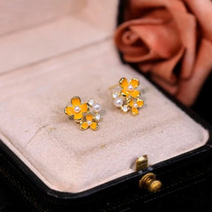 Angled view of the 14K Gold-Plated Diamond Pearl Osmanthus Stud Earrings