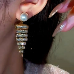 Angled view of the 14K Gold-Plated Diamond Pearl Tassel Earrings