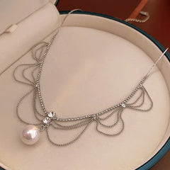 Close-up of the pendant and clasp on the Hollow Tassel Necklace