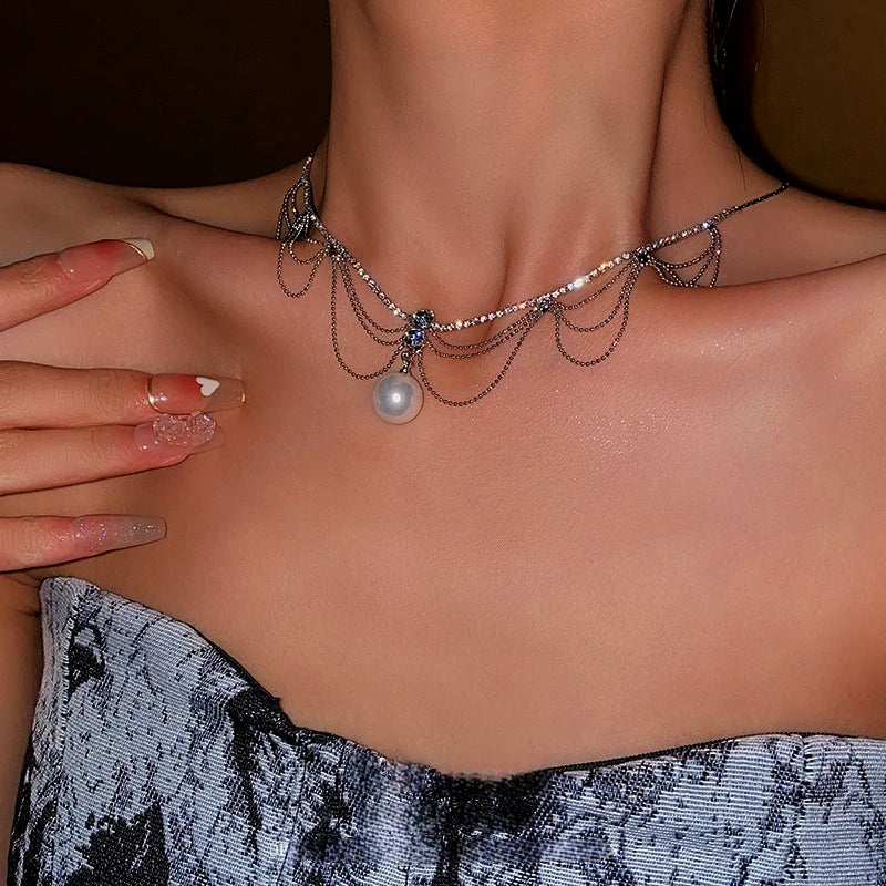 Detailed view of the 14K Gold-Plated Diamond Pearl Tassel Hollow Necklace chain and pendant