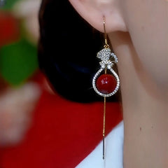 Close-up detail of the sparkling zircons and plating on the Purse Charm Earrings