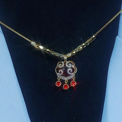 Close-up of the pendant and clasp on the Ruyi Lock Necklace