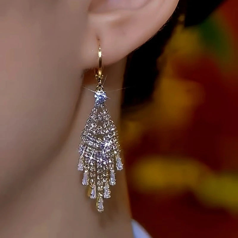 Close-up detail of the sparkling zircons and plating on the Gold Tassel Earrings