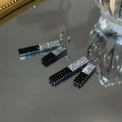 Angled view of the 14K Gold-Plated Diamond Tassel Earrings