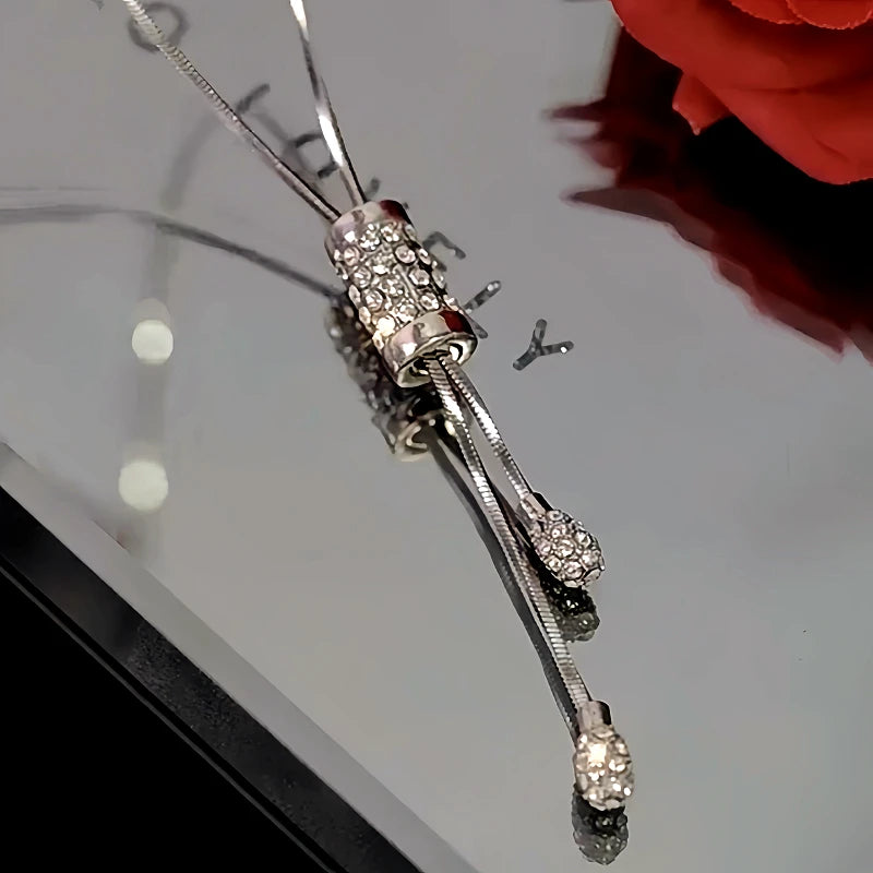 14K Gold-Plated Diamond Tassel Sweater Chain Necklace worn to showcase its length and pendant detail