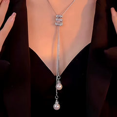 Detailed view of the 14K Gold-Plated Diamond Tassel Sweater Chain Necklace chain and pendant