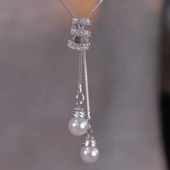 14K Gold-Plated Diamond Tassel Sweater Chain Necklace worn to showcase its length and pendant detail