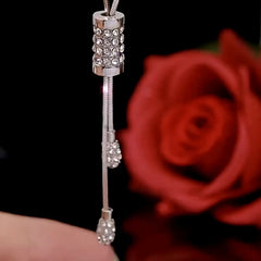 Close-up of the pendant and clasp on the Tassel Sweater Necklace