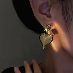 Close-up detail of the sparkling zircons and plating on the Double-Heart Earrings