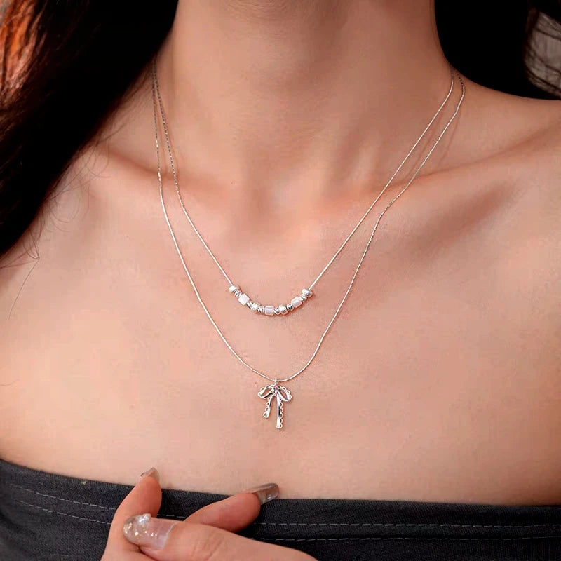 Close-up of the pendant and clasp on the Double-Layer Necklace