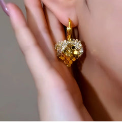 Close-up detail of the sparkling zircons and plating on the Heart Earrings