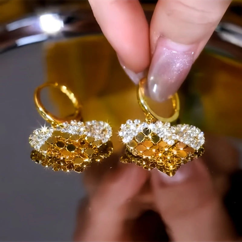 Angled view of the 14K Gold-Plated Double-Layer Diamond Sequin Heart Earrings