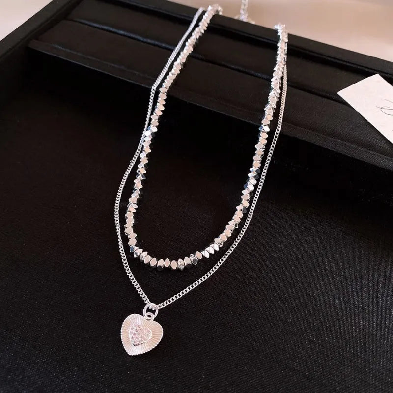 Detailed view of the 14K Gold-Plated Double-Layer Heart Necklace chain and pendant