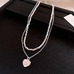 Detailed view of the 14K Gold-Plated Double-Layer Heart Necklace chain and pendant