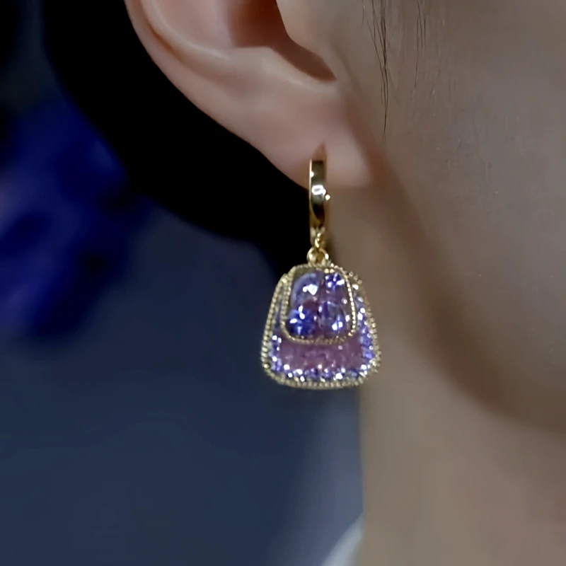 Model showcasing the dangle and style of the 14K Gold-Plated Double-Layer Purple Diamond Crystal Tassel Earrings