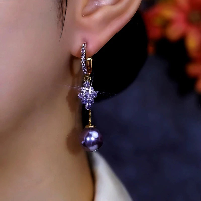 Close-up detail of the sparkling zircons and plating on the Purple Zircon Earrings
