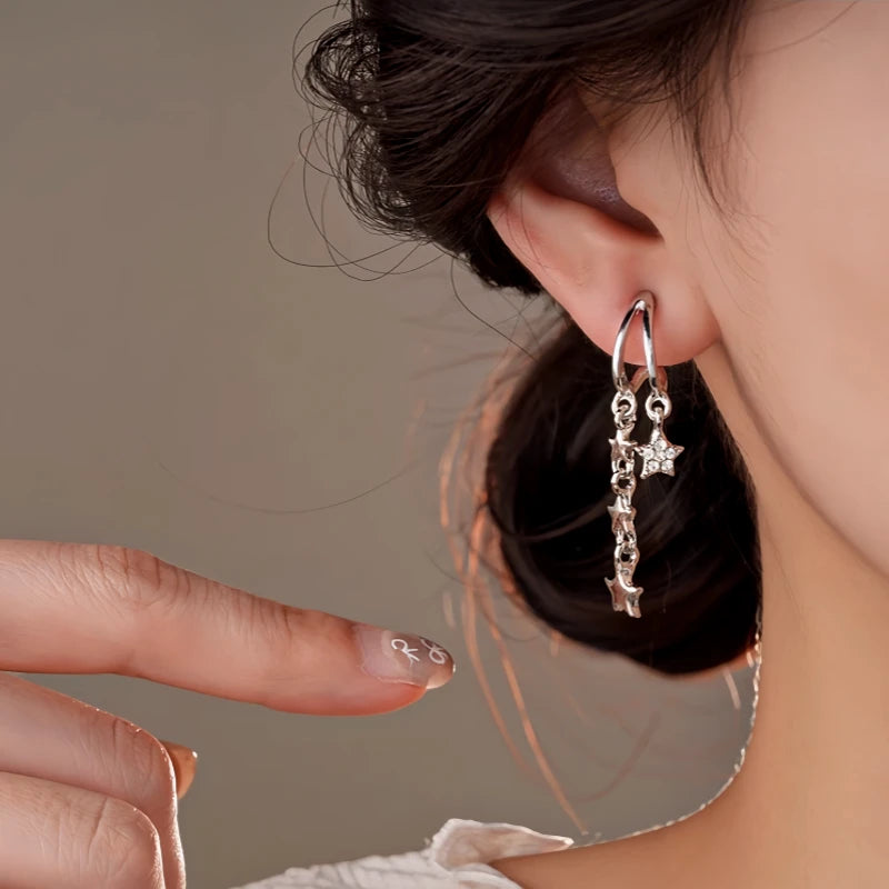 Close-up detail of the sparkling zircons and plating on the Star Tassel Earrings