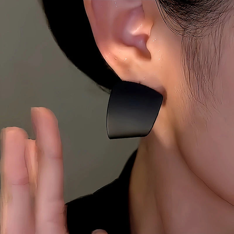 Model showcasing the dangle and style of the 14K Gold-Plated Double-Sided Contrasting Earrings