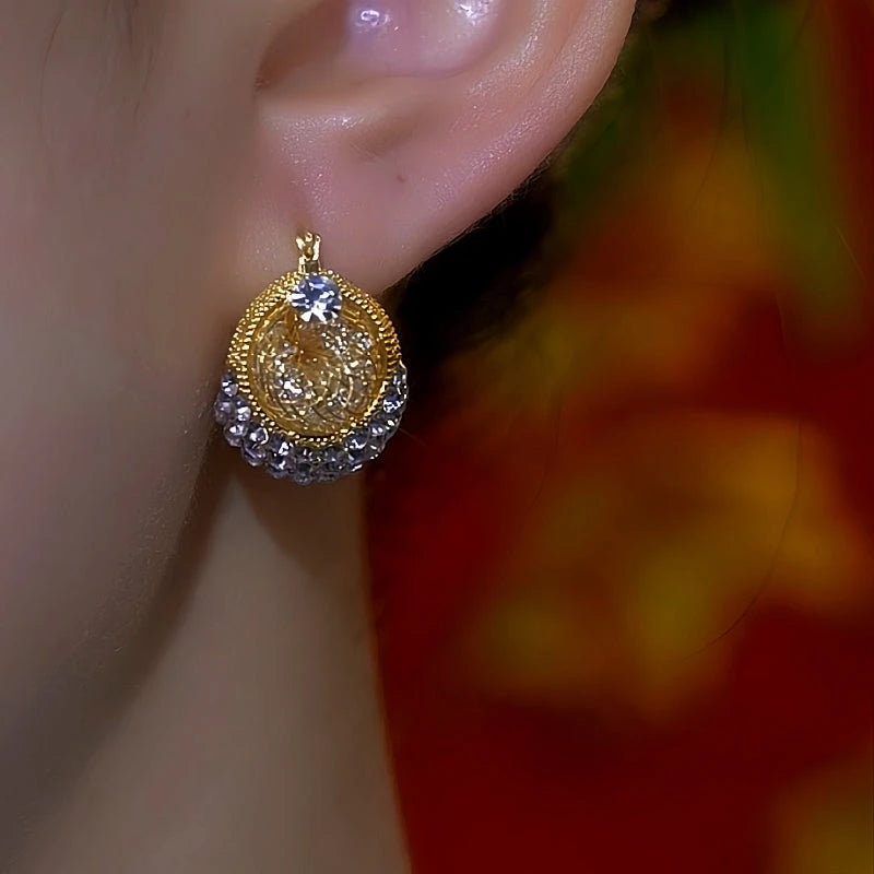 Model showcasing the dangle and style of the 14K Gold-Plated Double-Sided Mesh Zircon Diamond Earrings