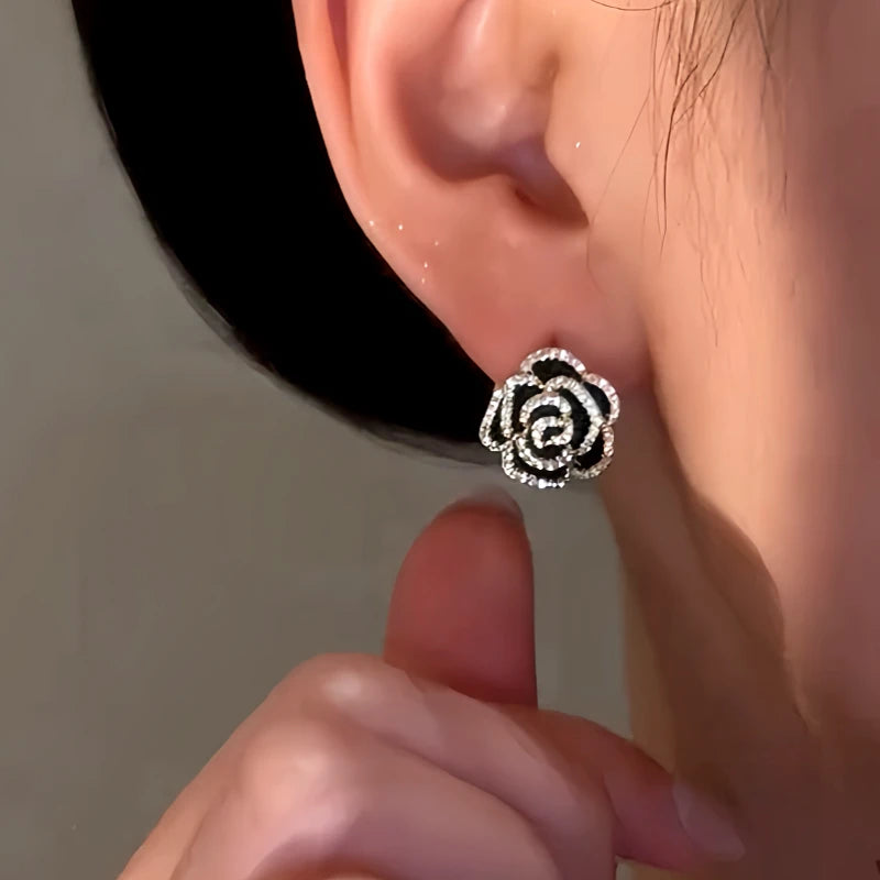 Close-up detail of the sparkling zircons and plating on the Rose Earrings