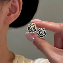Angled view of the 14K Gold-Plated Double-Sided Rose Earrings