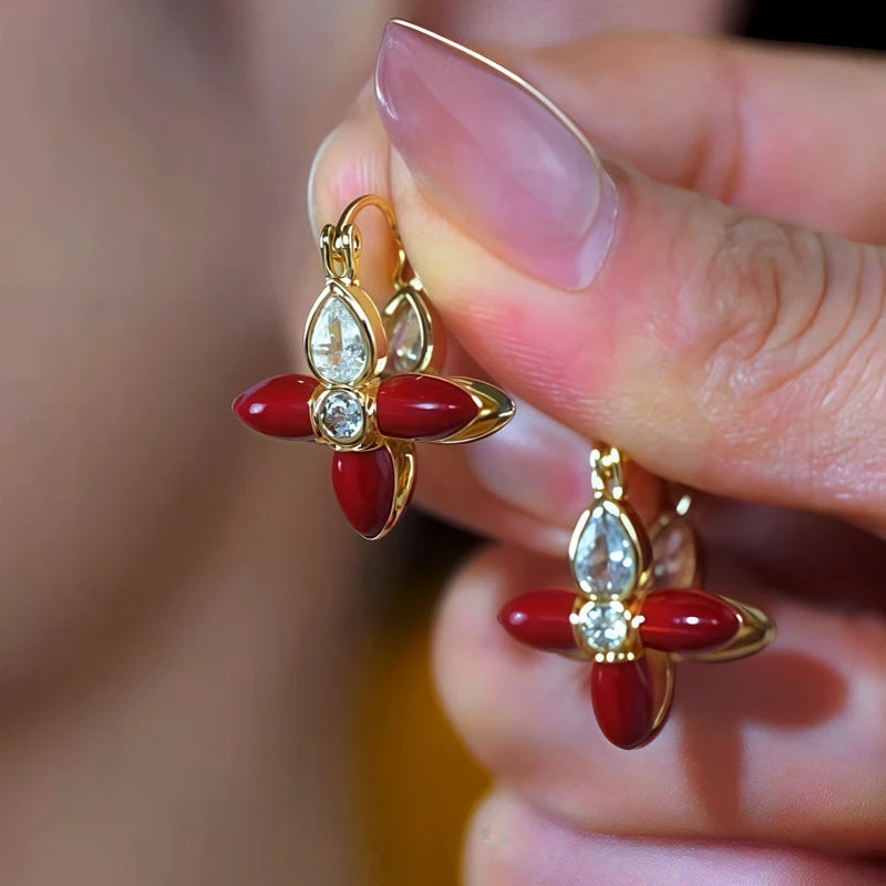 Model showcasing the dangle and style of the 14K Gold-Plated Double-Sided Zircon Flower Earrings