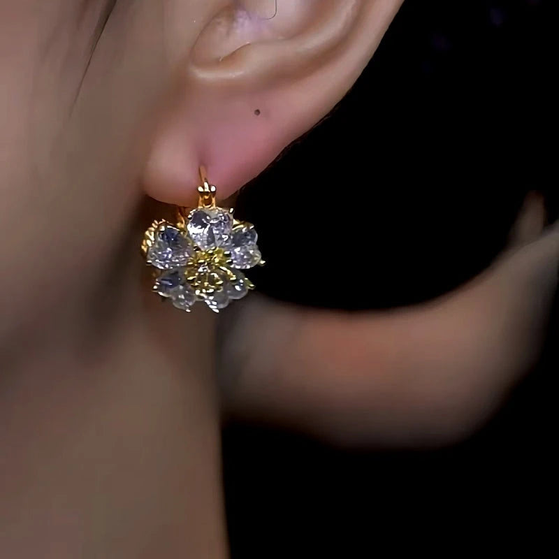 Close-up detail of the sparkling zircons and plating on the Double-Sided Flower Earrings