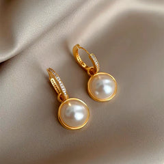 Close-up detail of the sparkling zircons and plating on the Double-Sided Pearl Earrings