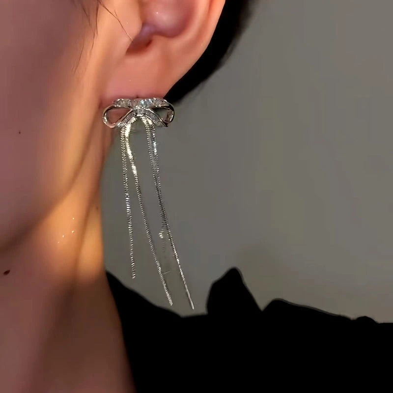 Close-up detail of the sparkling zircons and plating on the Bow Tassel Earrings