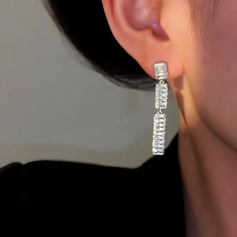 Close-up detail of the sparkling zircons and plating on the Zircon Tassel Earrings