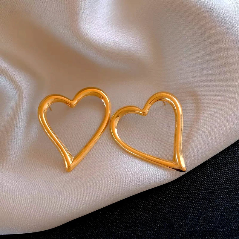 Close-up detail of the sparkling zircons and plating on the Hollow Heart Earrings