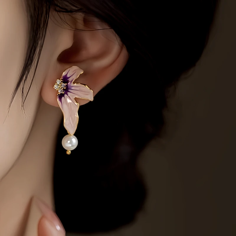 Close-up detail of the sparkling zircons and plating on the Asymmetrical Flower Earrings