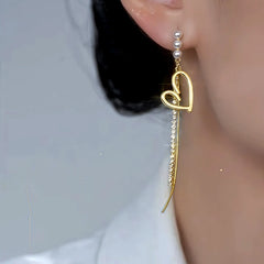 Close-up detail of the sparkling zircons and plating on the Asymmetrical Pearl Earrings