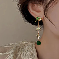 Angled view of the 14K Gold-Plated Elegant Bamboo Earrings