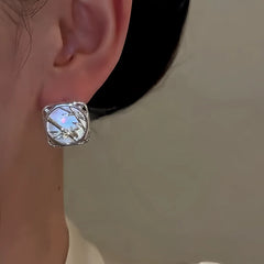 Model showcasing the dangle and style of the 14K Gold-Plated Elegant Bamboo Mirror Rings