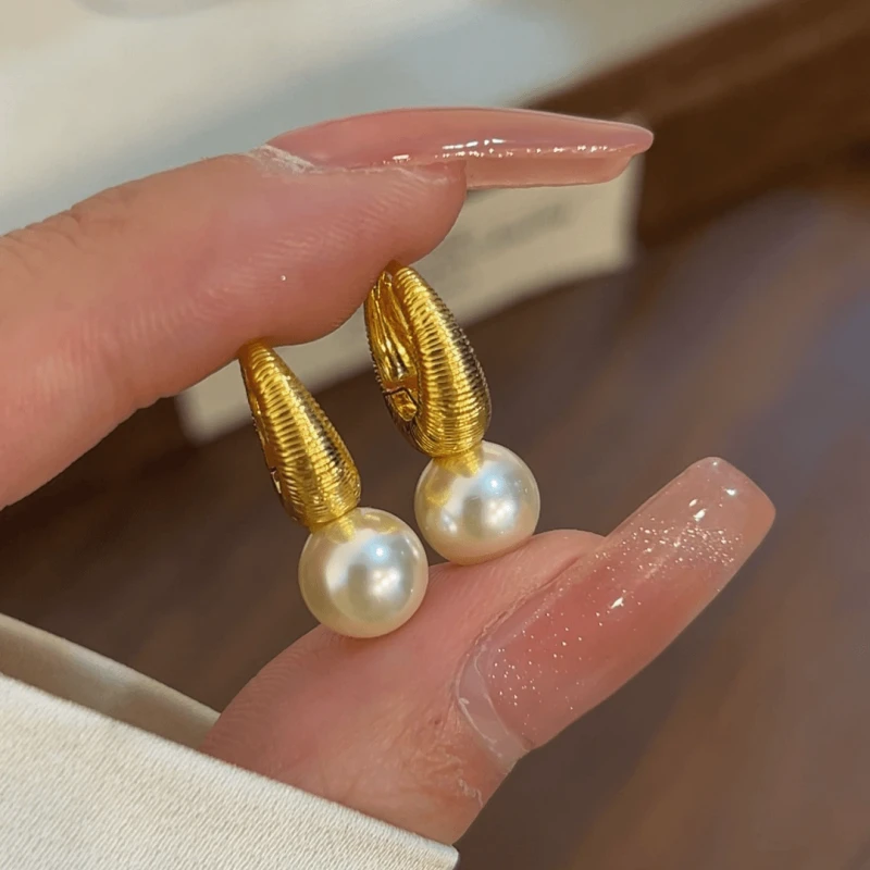 Angled view of the 14K Gold-Plated Elegant Bead Earrings