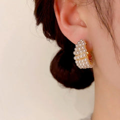 Close-up detail of the sparkling zircons and plating on the Gold Beaded Earrings