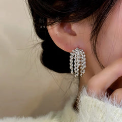Angled view of the 14K Gold-Plated Elegant Beaded Tassel Earrings