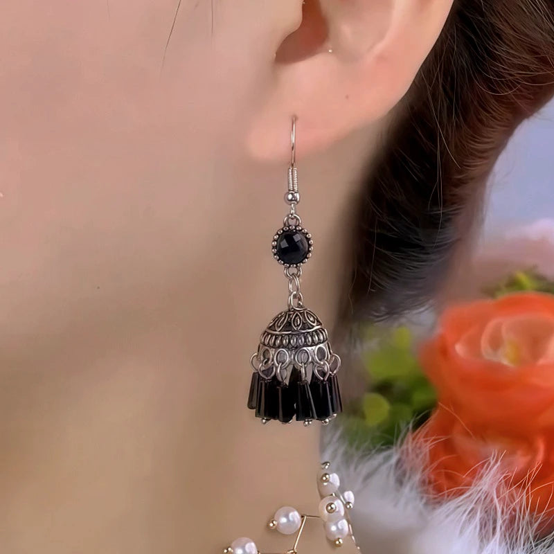 Model showcasing the dangle and style of the 14K Gold-Plated Elegant Black Crystal Ear Hooks