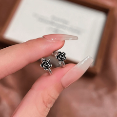 Angled view of the 14K Gold-Plated Elegant Black Rose Hoop Earrings