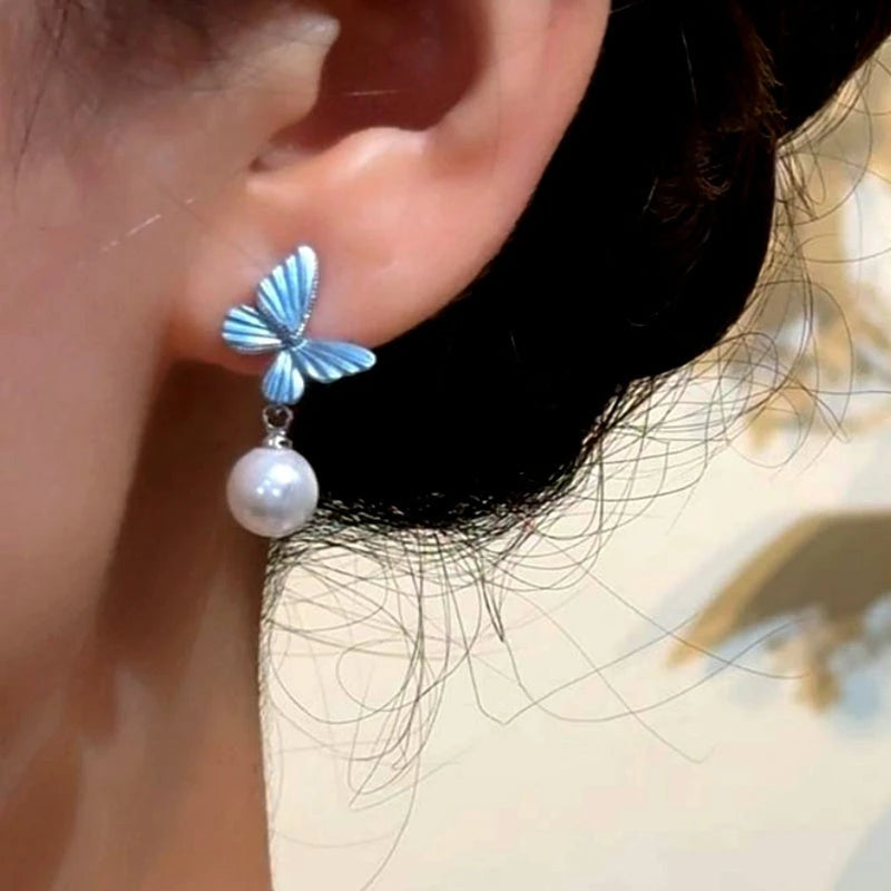 Close-up detail of the sparkling zircons and plating on the Blue Butterfly Earrings