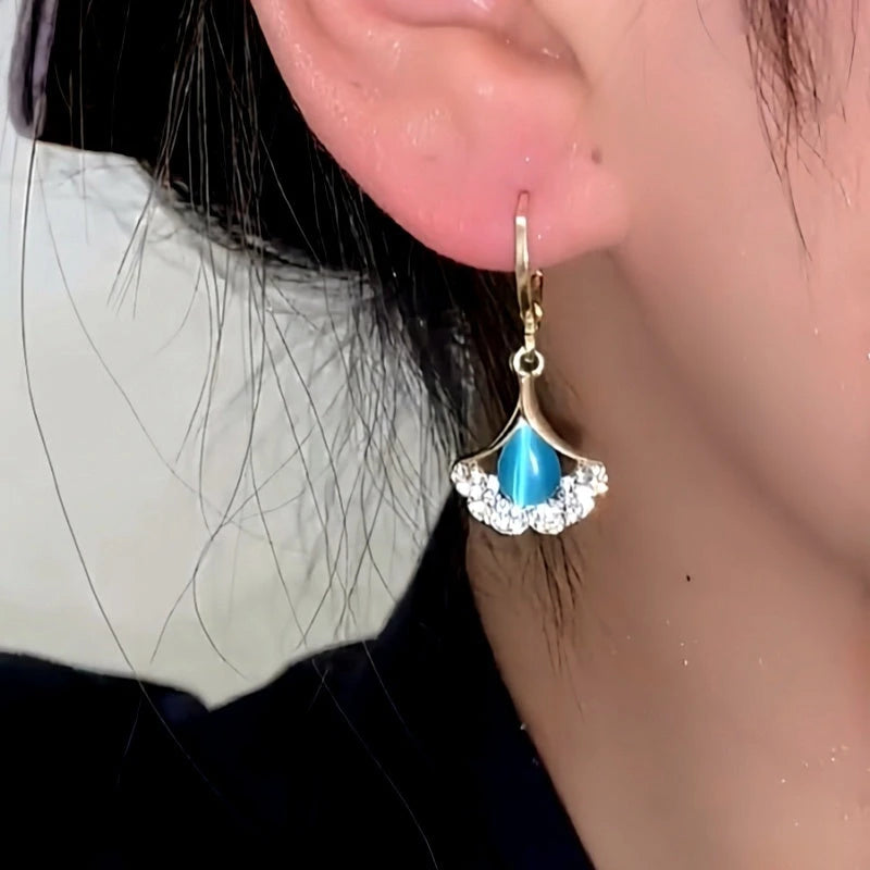 Close-up detail of the sparkling zircons and plating on the Ginkgo Leaf Earrings