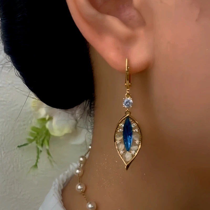 Close-up detail of the sparkling zircons and plating on the Leaf Earrings