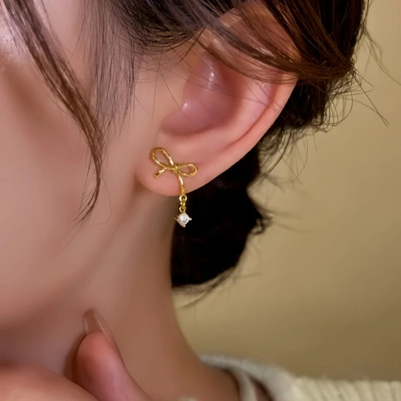 Close-up detail of the sparkling zircons and plating on the Bow Water Drop Earrings