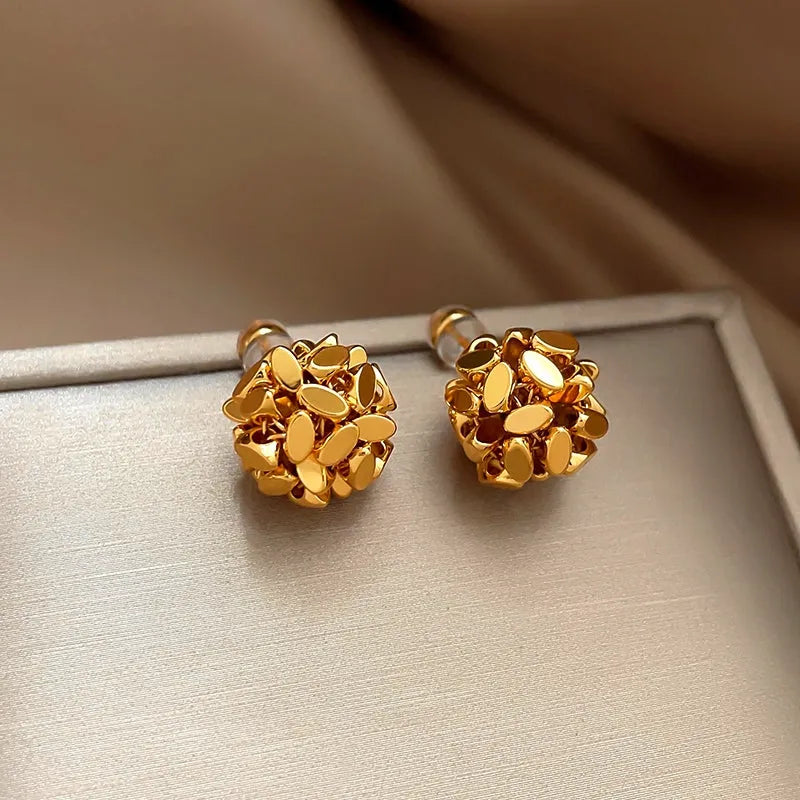 Close-up detail of the sparkling zircons and plating on the Ball Stud Earrings