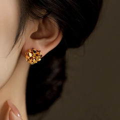 Angled view of the 14K Gold-Plated Elegant Broken Ball Stud Earrings