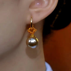 Close-up detail of the sparkling zircons and plating on the Zircon Pearl Earrings
