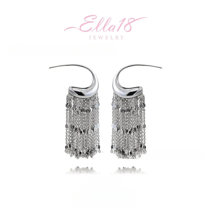 Model showcasing the dangle and style of the 14K Gold-Plated Elegant C-Shaped Tassel Earrings