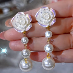 Angled view of the 14K Gold-Plated Elegant Camellia Bead Tassel Earrings