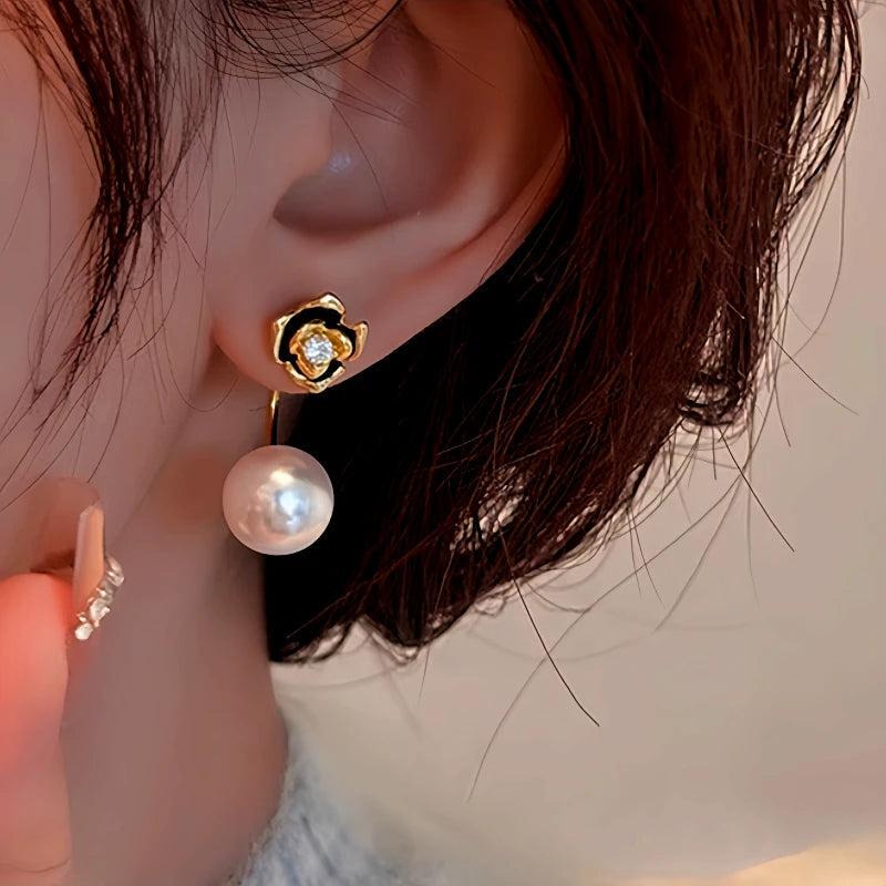 Close-up detail of the sparkling zircons and plating on the Camellia Pearl Ear Jackets